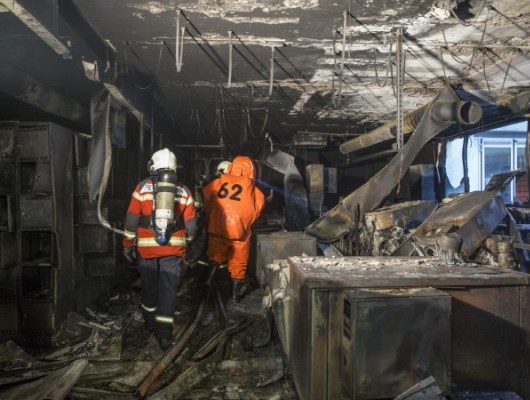 Firefighters Surveying the Swatch Group Fire Damage